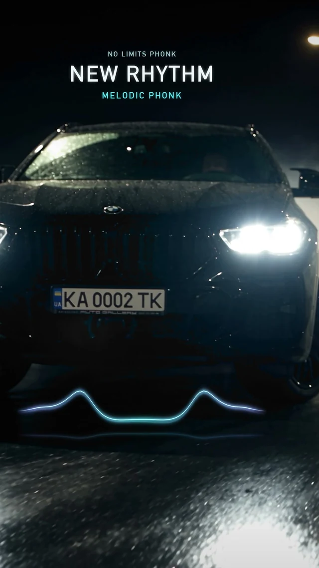 NEW RHYTHM — black BMW in blue light and drifting smoke